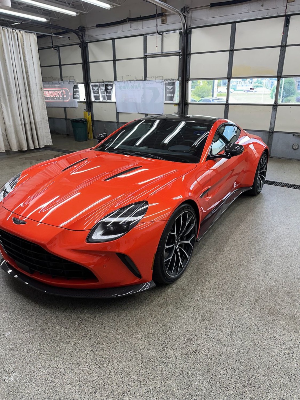 Orange Aston Martin Vantage after a full paint correction